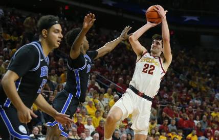 Iowa State Cyclones forward Milan Momcilovic (22) takes a shot over BYU Cougars guard Jaxson Robinson (2) during the first half in the Senior Day Big-12 conference showdown of an NCAA college basketball at Hilton Coliseum on Wednesday, March 6, 2024, in Ames, Iowa.