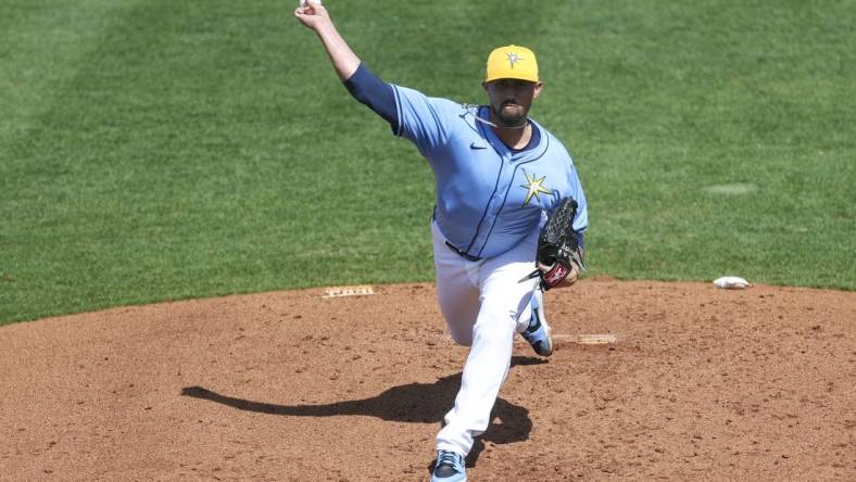 Mar 7, 2024; Port Charlotte, Florida, USA;  Tampa Bay Rays relief pitcher Shawn Armstrong (64) throws a pitch against the Philadelphia Phillies in the third inning at Charlotte Sports Park. Mandatory Credit: Nathan Ray Seebeck-USA TODAY Sports