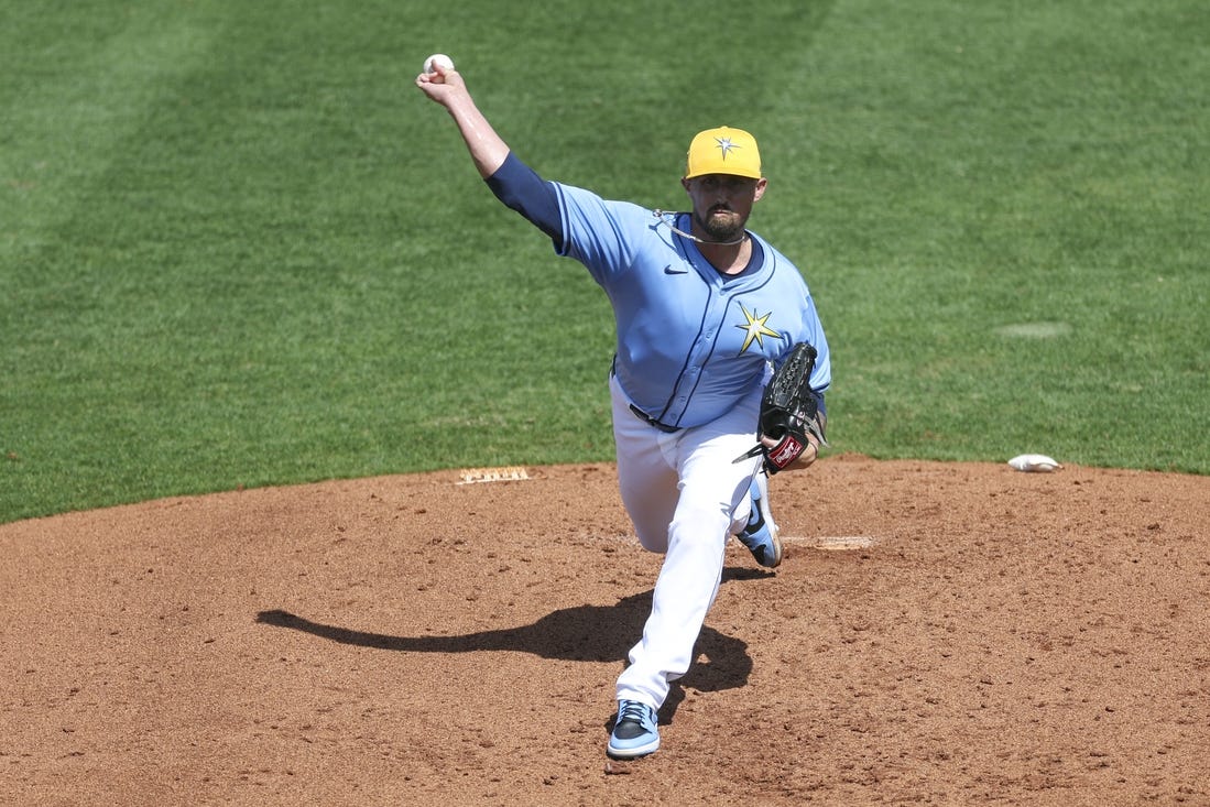 Mar 7, 2024; Port Charlotte, Florida, USA;  Tampa Bay Rays relief pitcher Shawn Armstrong (64) throws a pitch against the Philadelphia Phillies in the third inning at Charlotte Sports Park. Mandatory Credit: Nathan Ray Seebeck-USA TODAY Sports