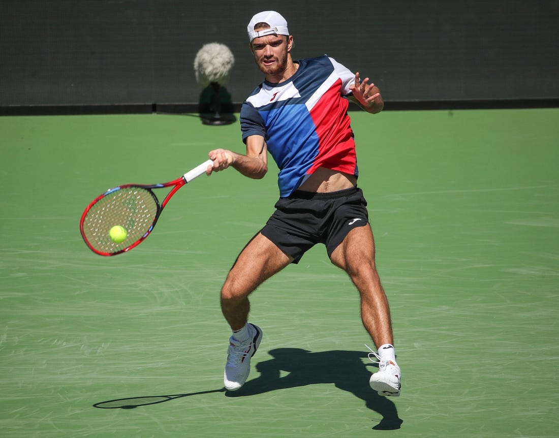 Tomas Machac hits a shot during his match against Stan Wawrinka on Stadium 1 at the BNP Paribas Open in Indian Wells, Calif., Mar. 7, 2024.