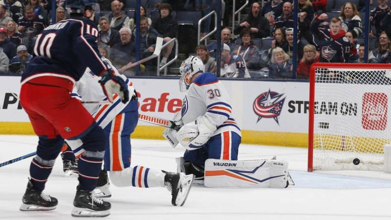 Mar 7, 2024; Columbus, Ohio, USA; the shot from Columbus Blue Jackets left wing Dmitri Voronkov (10) beats Edmonton Oilers goalie Calvin Pickard (30) for a goal during the first period at Nationwide Arena. Mandatory Credit: Russell LaBounty-USA TODAY Sports