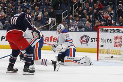 Mar 7, 2024; Columbus, Ohio, USA; the shot from Columbus Blue Jackets left wing Dmitri Voronkov (10) beats Edmonton Oilers goalie Calvin Pickard (30) for a goal during the first period at Nationwide Arena. Mandatory Credit: Russell LaBounty-USA TODAY Sports