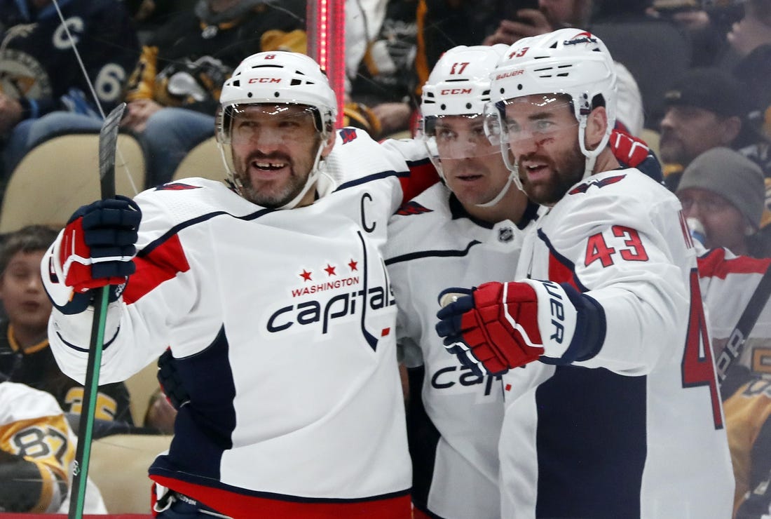 Mar 7, 2024; Pittsburgh, Pennsylvania, USA; Washington Capitals left wing Alex Ovechkin (left) celebrates his power play goal with right wing Tom Wilson (43) and center Dylan Strome (17) against the Pittsburgh Penguins during the second period at PPG Paints Arena. Mandatory Credit: Charles LeClaire-USA TODAY Sports