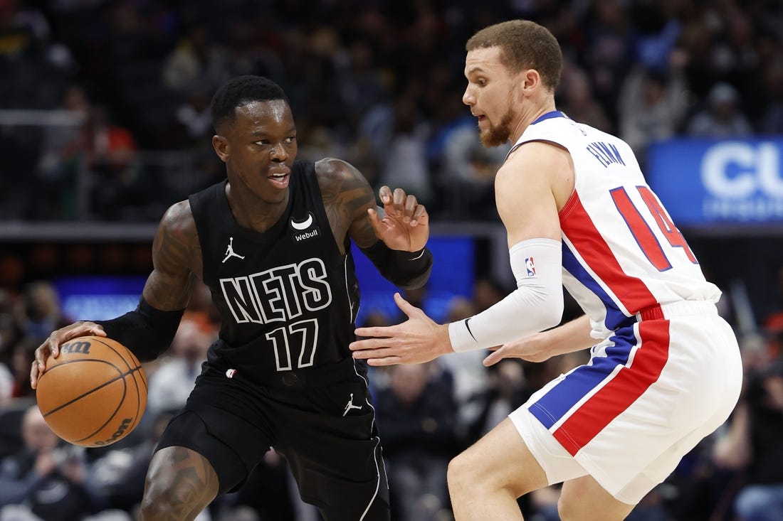 Mar 7, 2024; Detroit, Michigan, USA;  Brooklyn Nets guard Dennis Schroder (17) dribbles defended by Detroit Pistons guard Malachi Flynn (14) in the second half at Little Caesars Arena. Mandatory Credit: Rick Osentoski-USA TODAY Sports