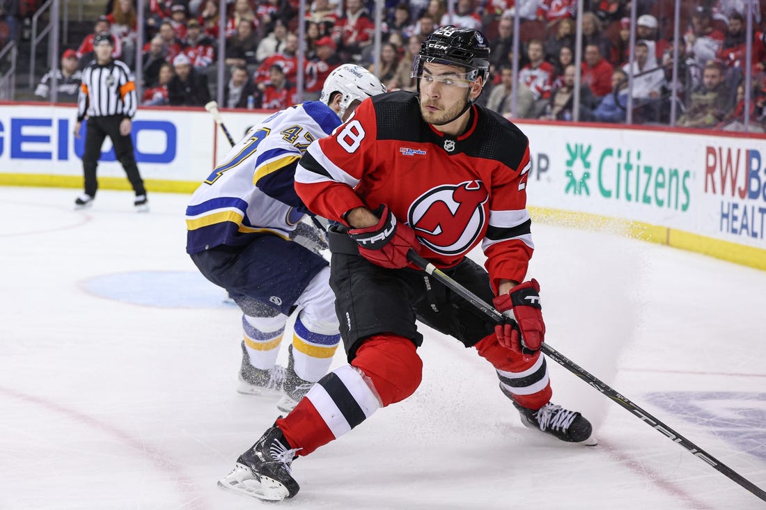 Mar 7, 2024; Newark, New Jersey, USA; New Jersey Devils right wing Timo Meier (28) looks back during the third period in front of St. Louis Blues defenseman Torey Krug (47) at Prudential Center. Mandatory Credit: Vincent Carchietta-USA TODAY Sports