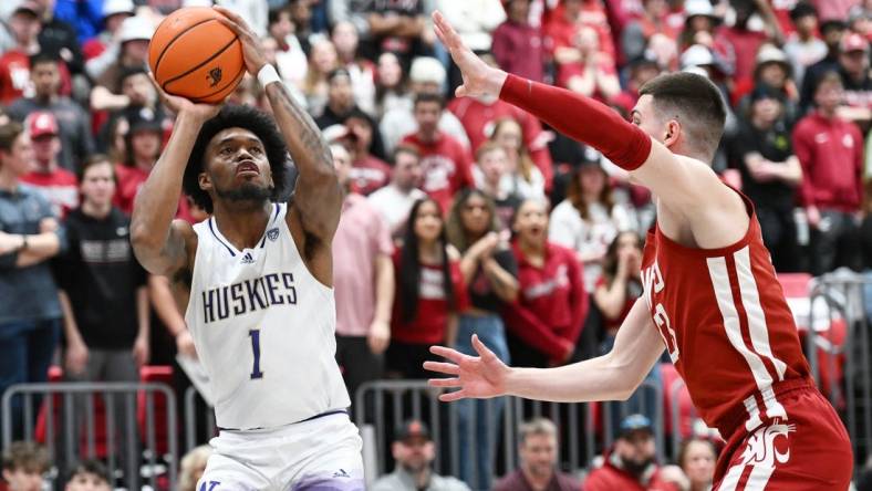 Mar 7, 2024; Pullman, Washington, USA; Washington Huskies forward Keion Brooks Jr. (1) shoots the ball against Washington State Cougars forward Andrej Jakimovski (23) in the first half at Friel Court at Beasley Coliseum. Mandatory Credit: James Snook-USA TODAY Sports