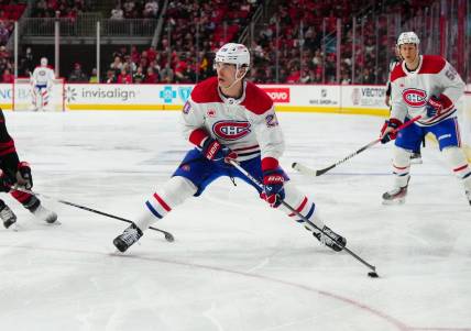Mar 7, 2024; Raleigh, North Carolina, USA; Montreal Canadiens left wing Juraj Slafkovsky (20) skates with the puck against the Carolina Hurricanes during the second period at PNC Arena. Mandatory Credit: James Guillory-USA TODAY Sports