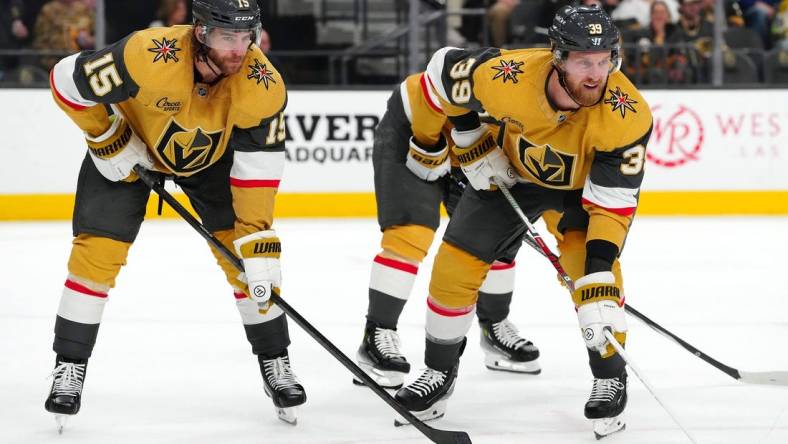 Mar 7, 2024; Las Vegas, Nevada, USA; Vegas Golden Knights defenseman Noah Hanifin (15) and Vegas Golden Knights right wing Anthony Mantha (39) await a face off against the Vancouver Canucks during the first period at T-Mobile Arena. Mandatory Credit: Stephen R. Sylvanie-USA TODAY Sports