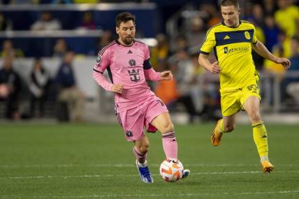 Mar 7, 2024; Nashville, TN, USA; Inter Miami forward Lionel Messi (10) dribbles against the Nashville SC during the second half at GEODIS Park. Mandatory Credit: Steve Roberts-USA TODAY Sports