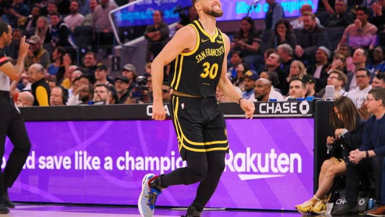 Mar 7, 2024; San Francisco, California, USA; Golden State Warriors guard Stephen Curry (30) limps around the court after a play against the Chicago Bulls during the fourth quarter at Chase Center. Mandatory Credit: Kelley L Cox-USA TODAY Sports