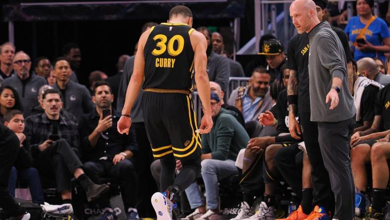 Mar 7, 2024; San Francisco, California, USA; Golden State Warriors guard Stephen Curry (30) limps off the court after a play against the Chicago Bulls during the fourth quarter at Chase Center. Mandatory Credit: Kelley L Cox-USA TODAY Sports