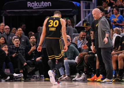 Mar 7, 2024; San Francisco, California, USA; Golden State Warriors guard Stephen Curry (30) limps off the court after a play against the Chicago Bulls during the fourth quarter at Chase Center. Mandatory Credit: Kelley L Cox-USA TODAY Sports