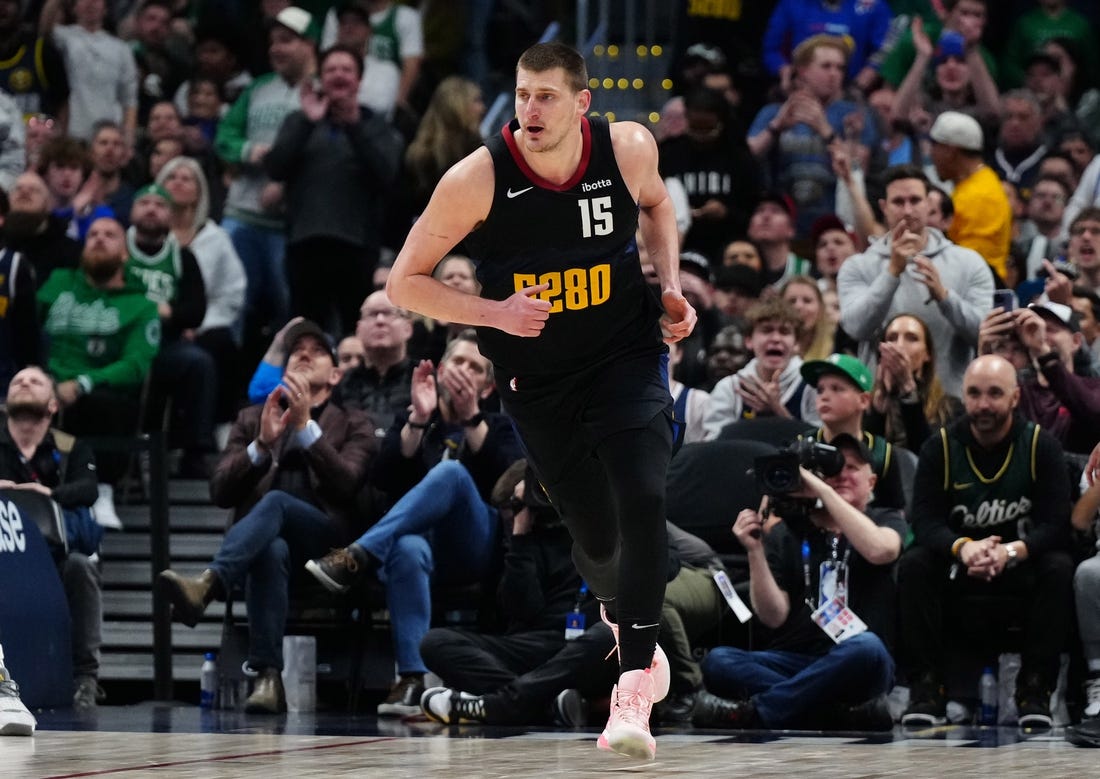 Mar 7, 2024; Denver, Colorado, USA; Denver Nuggets center Nikola Jokic (15) following his score in the second half against the Boston Celtics at Ball Arena. Mandatory Credit: Ron Chenoy-USA TODAY Sports