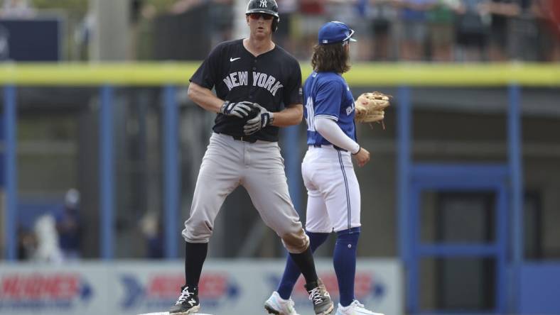 Mar 8, 2024; Dunedin, Florida, USA;  New York Yankees third baseman DJ LeMahieu (26) hits an rbi double against the Toronto Blue Jays in the third inning at TD Ballpark. Mandatory Credit: Nathan Ray Seebeck-USA TODAY Sports