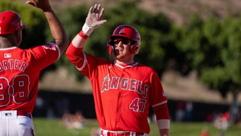 Mar 8, 2024; Tempe, Arizona, USA; Los Angeles Angels infielder Sam Brown (47) celebrates after hitting the go ahead run in the ninth to score outfielder Jordyn Adams (39) (not shown) in the ninth during a spring training game against the Colorado Rockies at Tempe Diablo Stadium. Mandatory Credit: Allan Henry-USA TODAY Sports