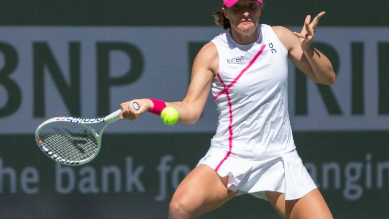 Iga Swiatek keeps her eyes on the ball against Danielle Collins during a second round BNP Paribas Open match at Indian Wells Tennis Garden in Indian Wells, California, on March 8, 2024.