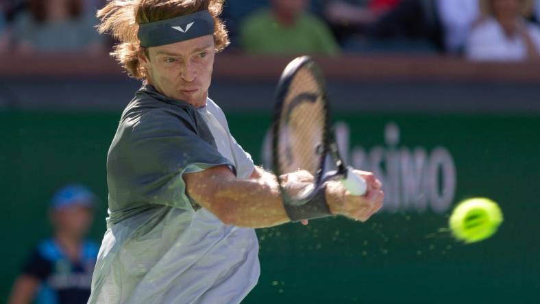 Andrey Rublev returns against Andy Murray during a BNP Paribas Open match at Indian Wells Tennis Garden in Indian Wells, California, on March 8, 2024.