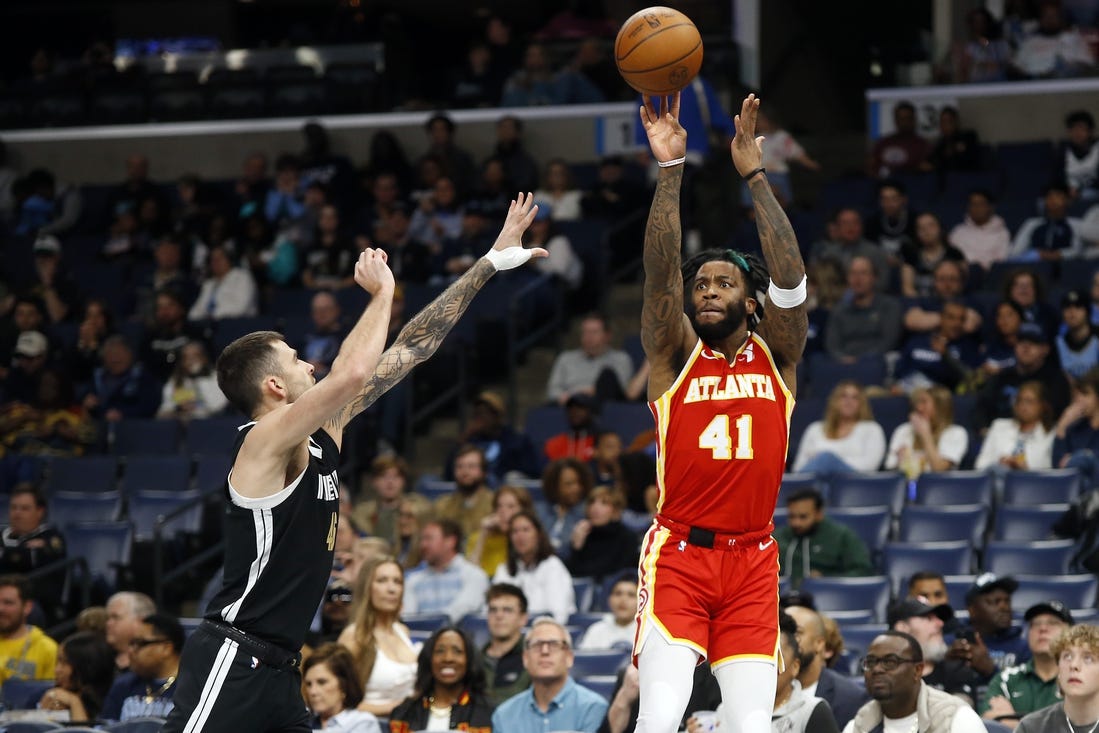 Mar 8, 2024; Memphis, Tennessee, USA; Atlanta Hawks forward Saddiq Bey (41) shoots for three as Memphis Grizzlies guard John Konchar (46) defends during the first half at FedExForum. Mandatory Credit: Petre Thomas-USA TODAY Sports