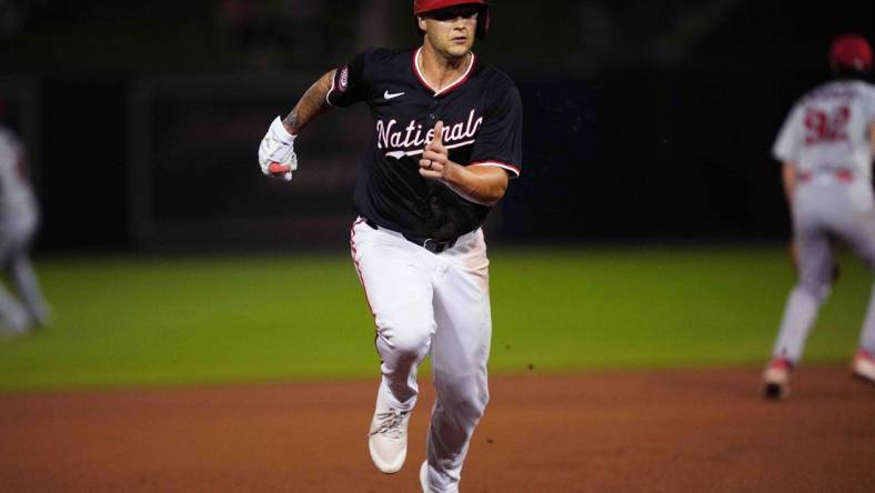 Mar 8, 2024; West Palm Beach, Florida, USA; Washington Nationals third baseman Nick Senzel (13) advances to third base on a base hit in the fourth inning against the St. Louis Cardinals at CACTI Park of the Palm Beaches. Mandatory Credit: Jim Rassol-USA TODAY Sports