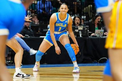 Mar 8, 2024; Las Vegas, NV, USA; UCLA Bruins guard Kiki Rice (1) dribbles against the USC Trojans during the first quarter at MGM Grand Garden Arena. Mandatory Credit: Stephen R. Sylvanie-USA TODAY Sports