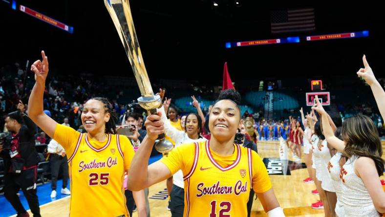 Mar 8, 2024; Las Vegas, NV, USA; USC Trojans guard JuJu Watkins (12) celebrates with USC Trojans guard McKenzie Forbes (25) after the Trojans defeated the UCLA Bruins 80-70 in double overtime at MGM Grand Garden Arena. Mandatory Credit: Stephen R. Sylvanie-USA TODAY Sports