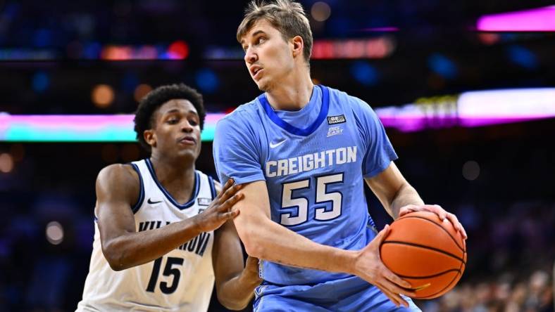 Mar 9, 2024; Philadelphia, Pennsylvania, USA; Creighton Bluejays guard Baylor Scheierman (55) controls the ball against Villanova Wildcats guard Jordan Longino (15) in the first half at Wells Fargo Center. Mandatory Credit: Kyle Ross-USA TODAY Sports