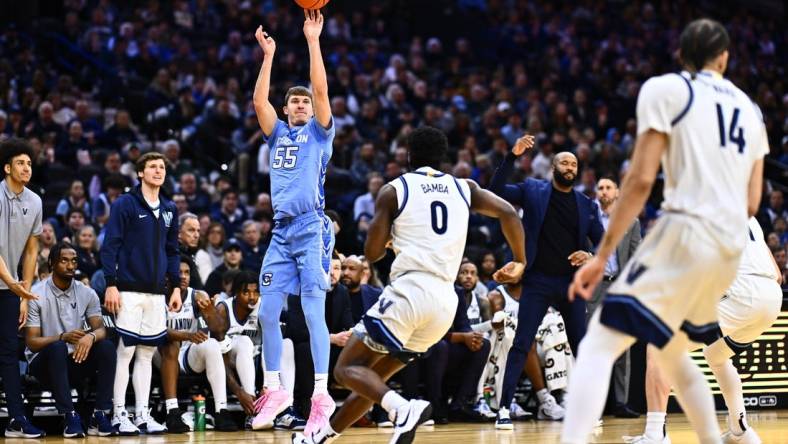 Mar 9, 2024; Philadelphia, Pennsylvania, USA; Creighton Bluejays guard Baylor Scheierman (55) shoots over Villanova Wildcats guard TJ Bamba (0) in the first half at Wells Fargo Center. Mandatory Credit: Kyle Ross-USA TODAY Sports