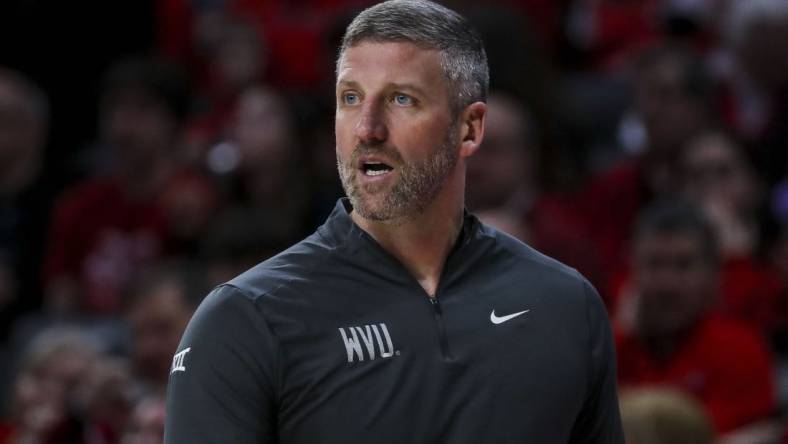 Mar 9, 2024; Cincinnati, Ohio, USA; West Virginia Mountaineers interim head coach Josh Eilert during the first half against the Cincinnati Bearcats at Fifth Third Arena. Mandatory Credit: Katie Stratman-USA TODAY Sports