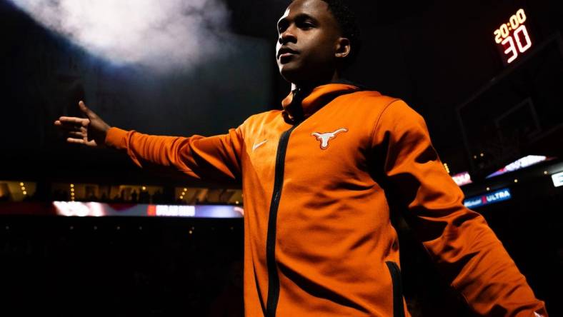 Texas Longhorns guard Max Abmas (3) gives out high-fives during the starting line-up announcement ahead of the Longhorns' game against the Oklahoma Sooners at the Moody Center in Austin, Saturday, March 9, 2024. Texas won the game 94-80.