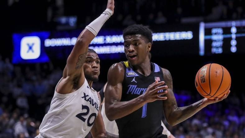 Mar 9, 2024; Cincinnati, Ohio, USA; Marquette Golden Eagles guard Kam Jones (1) dribbles against Xavier Musketeers guard Dayvion McKnight (20) in the first half at Cintas Center. Mandatory Credit: Katie Stratman-USA TODAY Sports