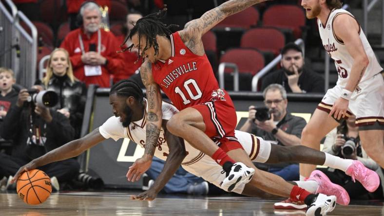 Mar 9, 2024; Louisville, Kentucky, USA;  Boston College Eagles guard Prince Aligbe (10) dives for the ball with Louisville Cardinals forward Kaleb Glenn (10) during the first half at KFC Yum! Center. Mandatory Credit: Jamie Rhodes-USA TODAY Sports