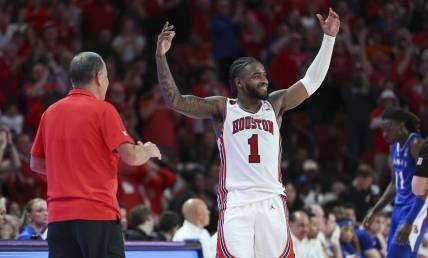 Mar 9, 2024; Houston, Texas, USA; Houston Cougars guard Jamal Shead (1) acknowledges the crowd after coming out of the game during the second half against the Kansas Jayhawks at Fertitta Center. Mandatory Credit: Troy Taormina-USA TODAY Sports