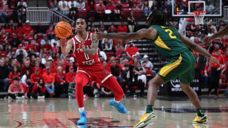 Mar 9, 2024; Lubbock, Texas, USA; Texas Tech Red Raiders guard Chance McMillian (0) passes the ball against Baylor Bears guard Jayden Nunn (2) in the first half at United Supermarkets Arena. Mandatory Credit: Michael C. Johnson-USA TODAY Sports