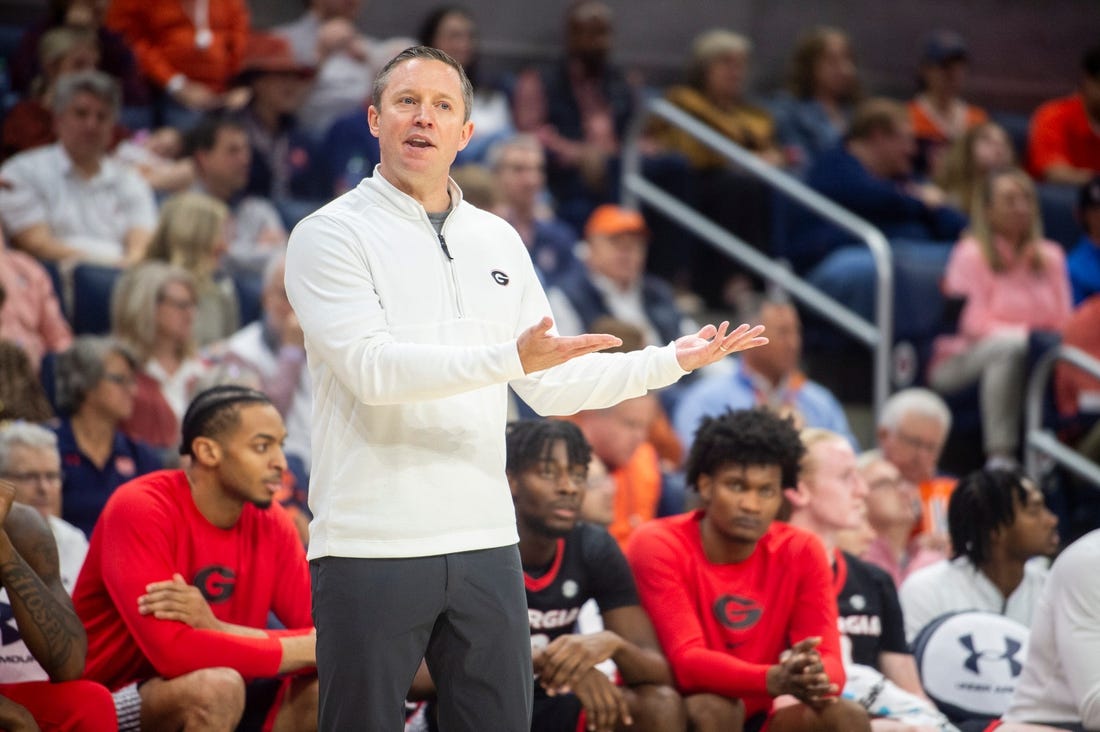 Georgia Bulldogs head coach Mike White talks with an official as Auburn Tigers take on Georgia Bulldogs at Neville Arena in Auburn, Ala., on Saturday, March 9, 2024. Auburn Tigers lead Georgia Bulldogs 45-31 at halftime.