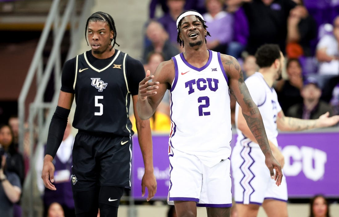 Mar 9, 2024; Fort Worth, Texas, USA; TCU Horned Frogs forward Emanuel Miller (2) reacts in front of UCF Knights forward Omar Payne (5) during the second half at Ed and Rae Schollmaier Arena. Mandatory Credit: Kevin Jairaj-USA TODAY Sports