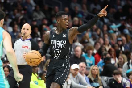 Mar 9, 2024; Charlotte, North Carolina, USA;  Brooklyn Nets guard Dennis Schroder (17) directs the play against the Charlotte Hornets during the first quarter at Spectrum Center. Mandatory Credit: Cory Knowlton-USA TODAY Sports
