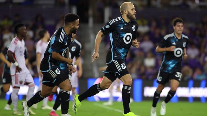 Mar 9, 2024; Orlando, Florida, USA; Minnesota United forward Teemu Pukki (22) celebrates with teammates after scoring a goal against Orlando City during the first half at Inter & Co Stadium. Mandatory Credit: Morgan Tencza-USA TODAY Sports