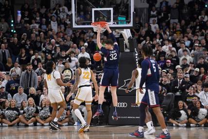 Mar 9, 2024; Providence, Rhode Island, USA: Connecticut Huskies center Donovan Clingan (32) makes a basket against the Providence Friars during the first half at Amica Mutual Pavilion. Mandatory Credit: Eric Canha-USA TODAY Sports