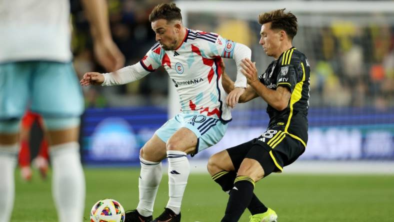 Mar 9, 2024; Columbus, Ohio, USA; Chicago Fire FC midfielder Xherdan Shaqiri (10) controls the ball as Columbus Crew defender Malte Amundsen (18) defends in the first half at Lower.com Field. Mandatory Credit: Trevor Ruszkowski-USA TODAY Sports