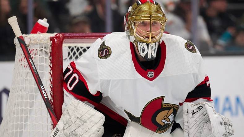 Mar 9, 2024; San Jose, California, USA; Ottawa Senators goaltender Joonas Korpisalo (70) watches the play against the San Jose Sharks during the second period at SAP Center at San Jose. Mandatory Credit: Robert Edwards-USA TODAY Sports