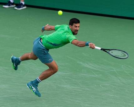 Novak Djokovic reaches for a shot during his match against Aleksandar Vukic at the BNP Paribas Open in Indian Wells Tennis Garden, California, on March 9, 2024.