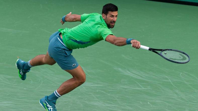 Novak Djokovic reaches for a shot during his match against Aleksandar Vukic at the BNP Paribas Open in Indian Wells Tennis Garden, California, on March 9, 2024.