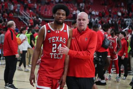 Mar 9, 2024; Lubbock, Texas, USA;  Texas Tech Red Raiders guard Kerwin Walton (24) with assistant coach Dave Smart after the game against the Baylor Bears at United Supermarkets Arena. Mandatory Credit: Michael C. Johnson-USA TODAY Sports