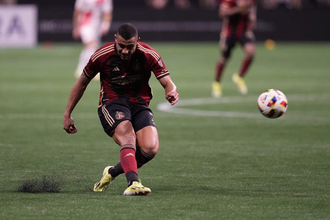 Mar 9, 2024; Atlanta, Georgia, USA; Atlanta United forward Giorgos Giakoumakis (7) shoots the ball against the New England Revolution during the second half at Mercedes-Benz Stadium. Mandatory Credit: Dale Zanine-USA TODAY Sports