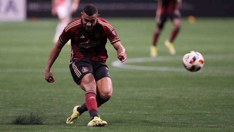 Mar 9, 2024; Atlanta, Georgia, USA; Atlanta United forward Giorgos Giakoumakis (7) shoots the ball against the New England Revolution during the second half at Mercedes-Benz Stadium. Mandatory Credit: Dale Zanine-USA TODAY Sports