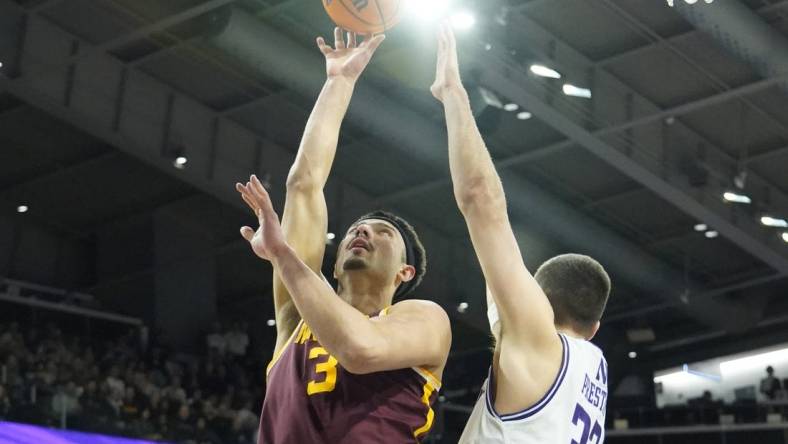 Mar 9, 2024; Evanston, Illinois, USA; Northwestern Wildcats forward Blake Preston (32) defends Minnesota Golden Gophers forward Dawson Garcia (3) during the first half at Welsh-Ryan Arena. Mandatory Credit: David Banks-USA TODAY Sports