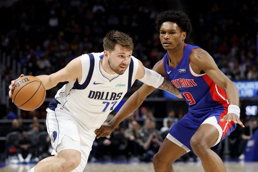 Mar 9, 2024; Detroit, Michigan, USA;  Dallas Mavericks guard Luka Doncic (77) dribbles against Detroit Pistons forward Ausar Thompson (9) in the first half at Little Caesars Arena. Mandatory Credit: Rick Osentoski-USA TODAY Sports