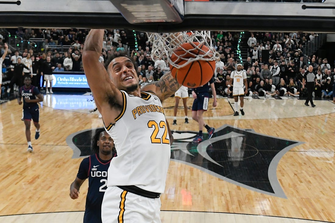 Mar 9, 2024; Providence, Rhode Island, USA; Providence Friars guard Devin Carter (22)  dunks the ball against the Connecticut Huskies during the first half at Amica Mutual Pavilion. Mandatory Credit: Eric Canha-USA TODAY Sports