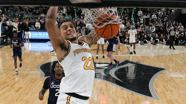 Mar 9, 2024; Providence, Rhode Island, USA; Providence Friars guard Devin Carter (22)  dunks the ball against the Connecticut Huskies during the first half at Amica Mutual Pavilion. Mandatory Credit: Eric Canha-USA TODAY Sports