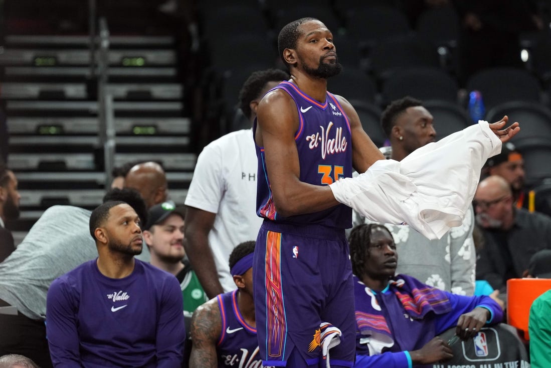 Mar 9, 2024; Phoenix, Arizona, USA; Phoenix Suns forward Kevin Durant (35) looks on from the bench during the second half against the Boston Celtics at Footprint Center. Mandatory Credit: Joe Camporeale-USA TODAY Sports